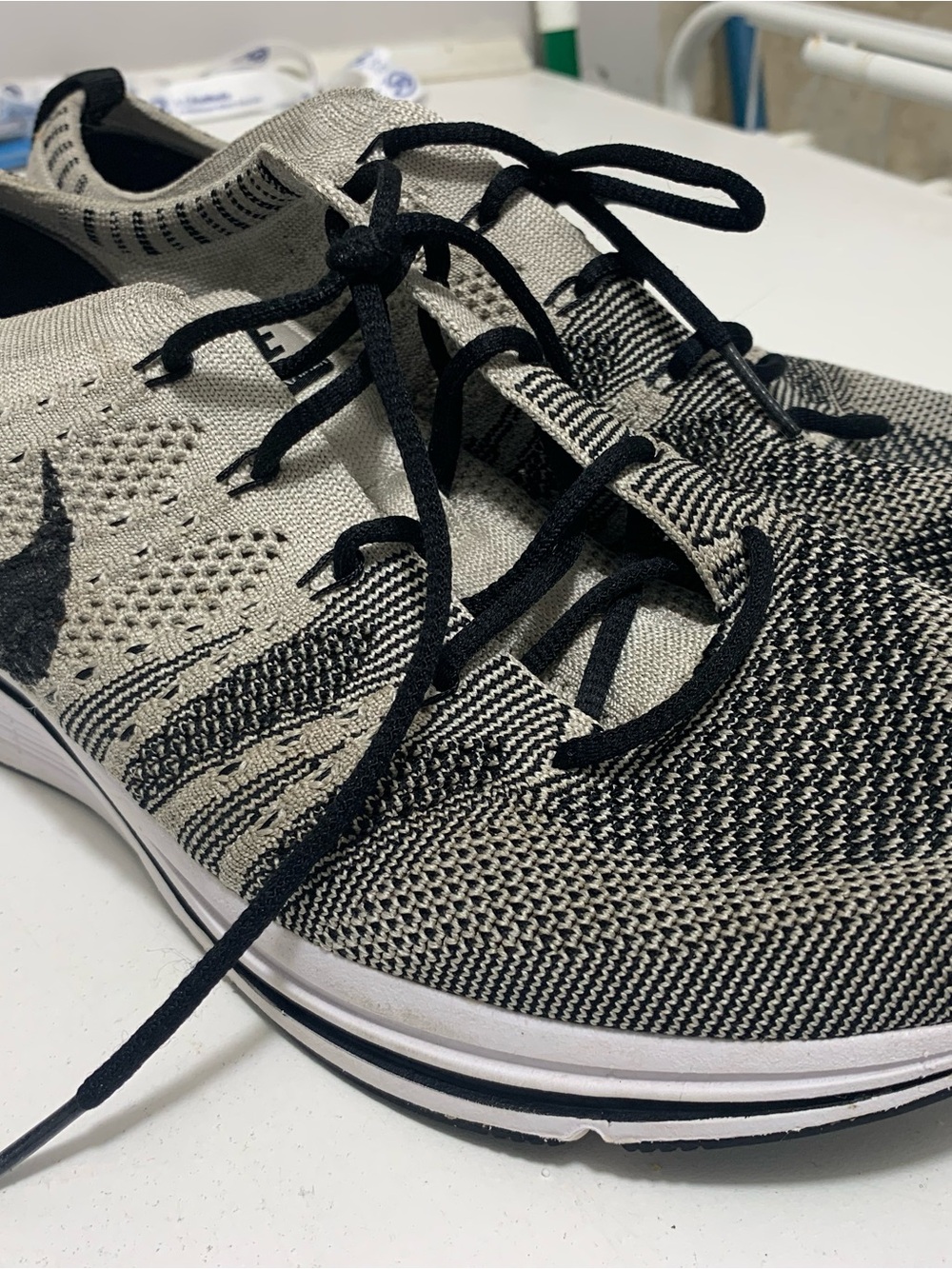Nike Flyknit Trainers in Black & Cream